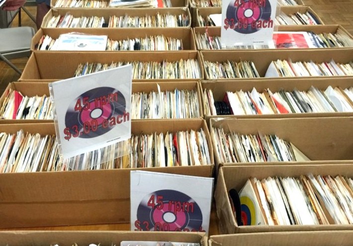 many 45 rpm records being sold in boxes at $3.00 each