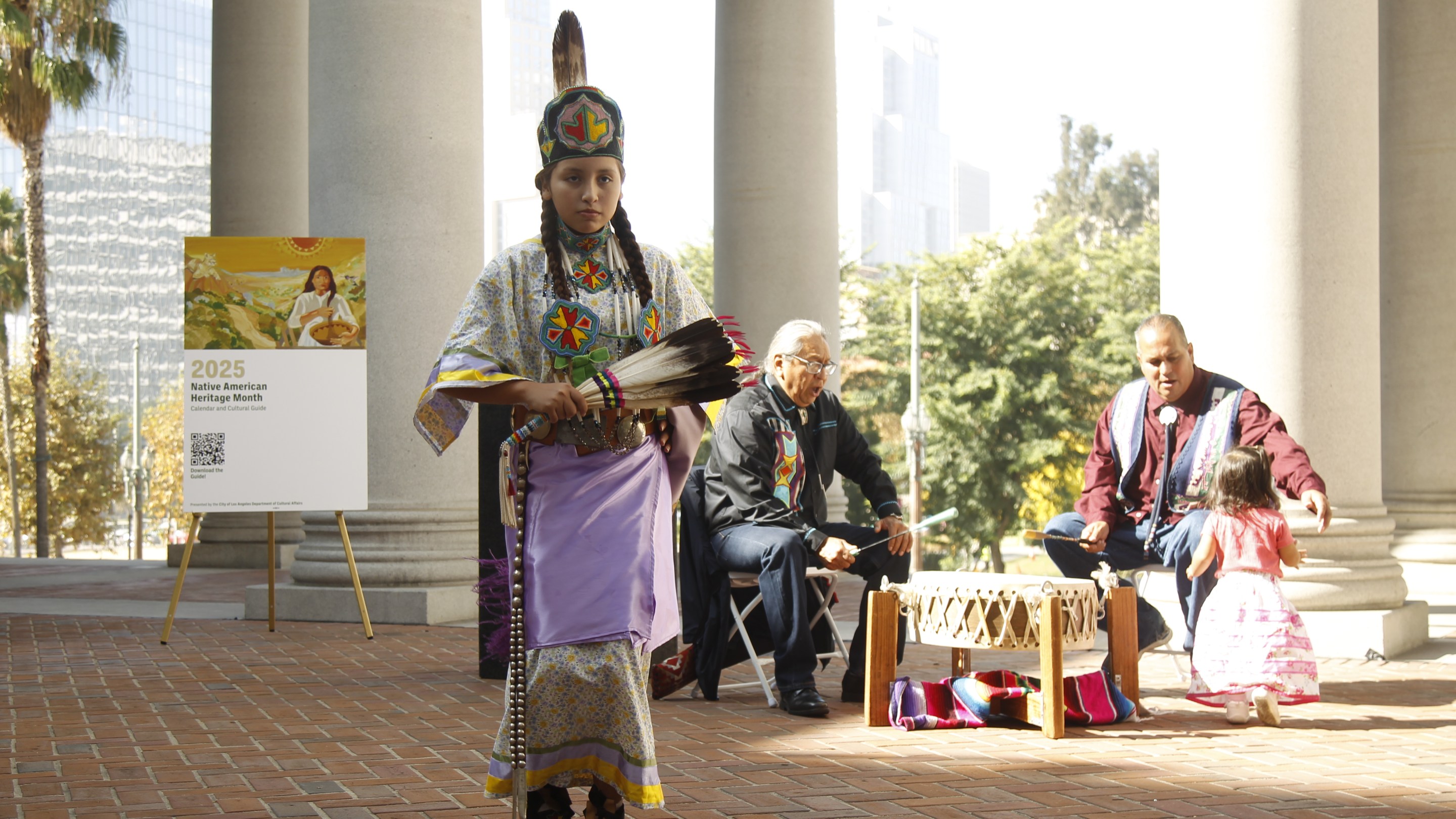 a young girl dressed in Indigenous clothing