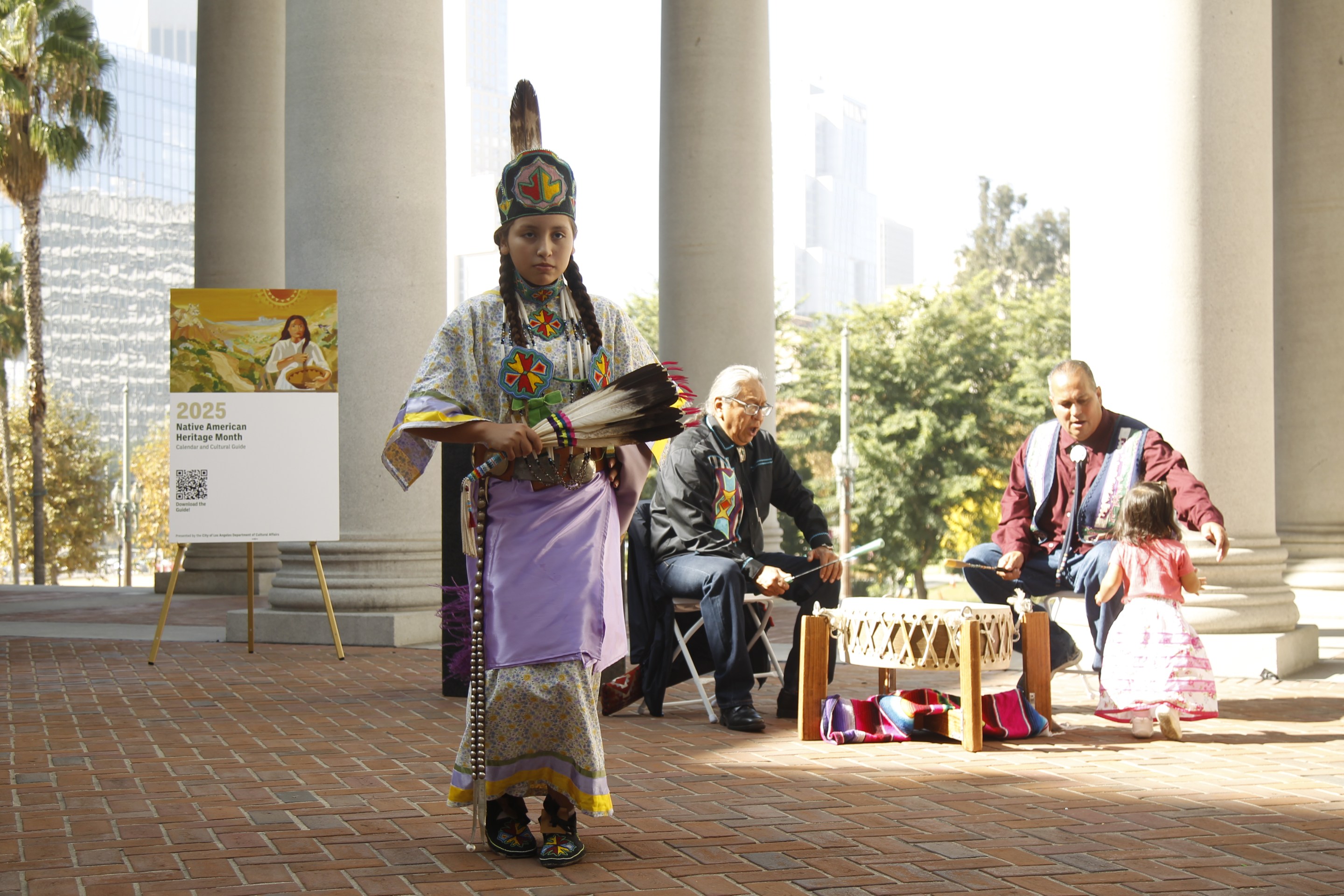 a young girl dressed in Indigenous clothing