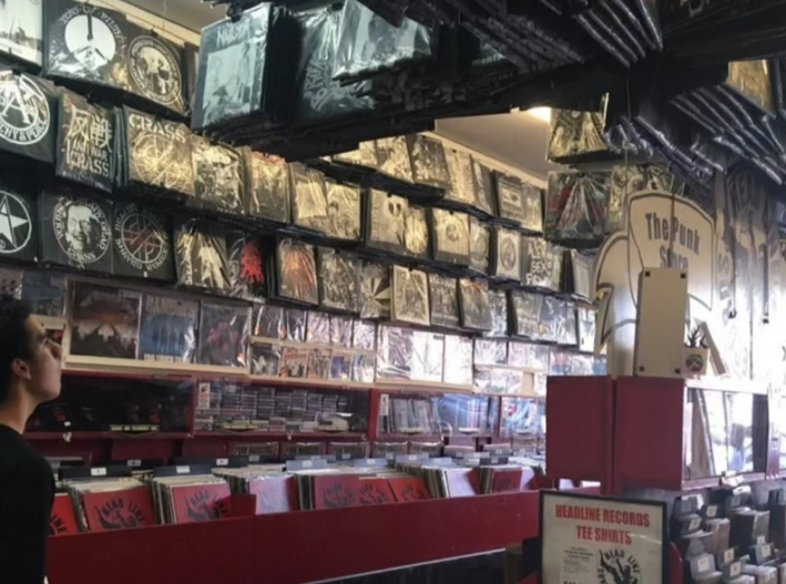vinyls are advertised and sold. they are hanging from the walls, ceiling, and also displayed throughout the store