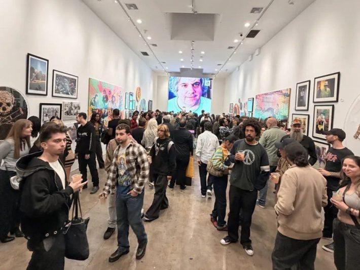 a crowd of people in a gallery