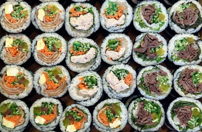A variety of kimbap filling the entire screen