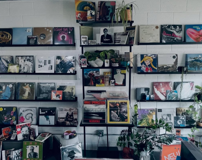 a wall of CDs on sale