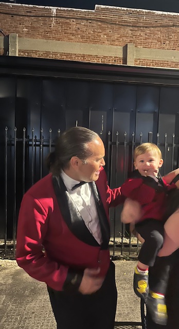 a man laughs with a toddler