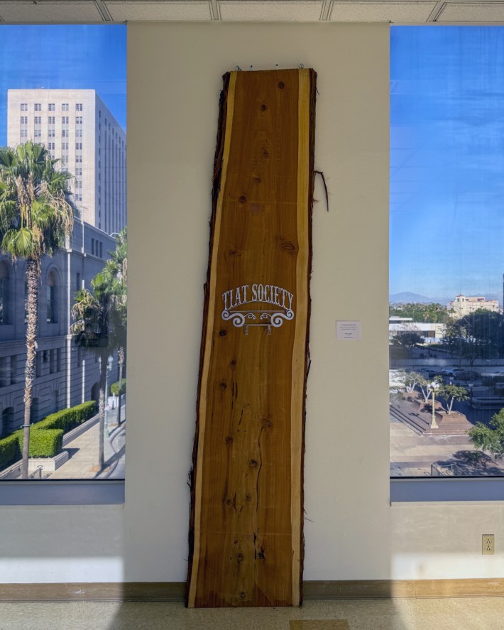 a piece of art on a large wooden plank