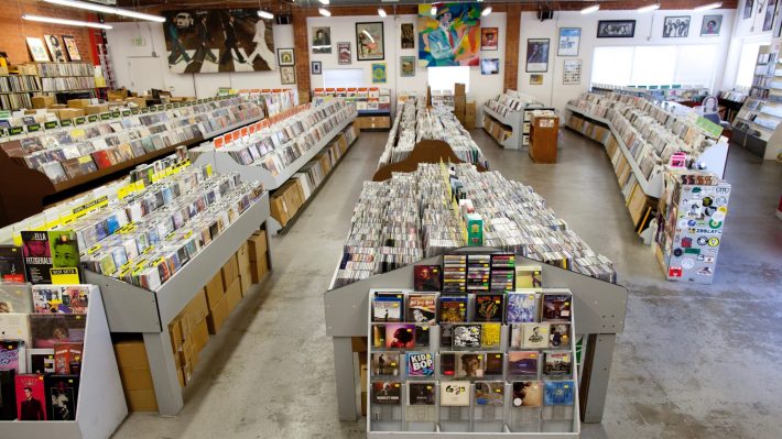 a large room full of vinyl records and cd's on sale