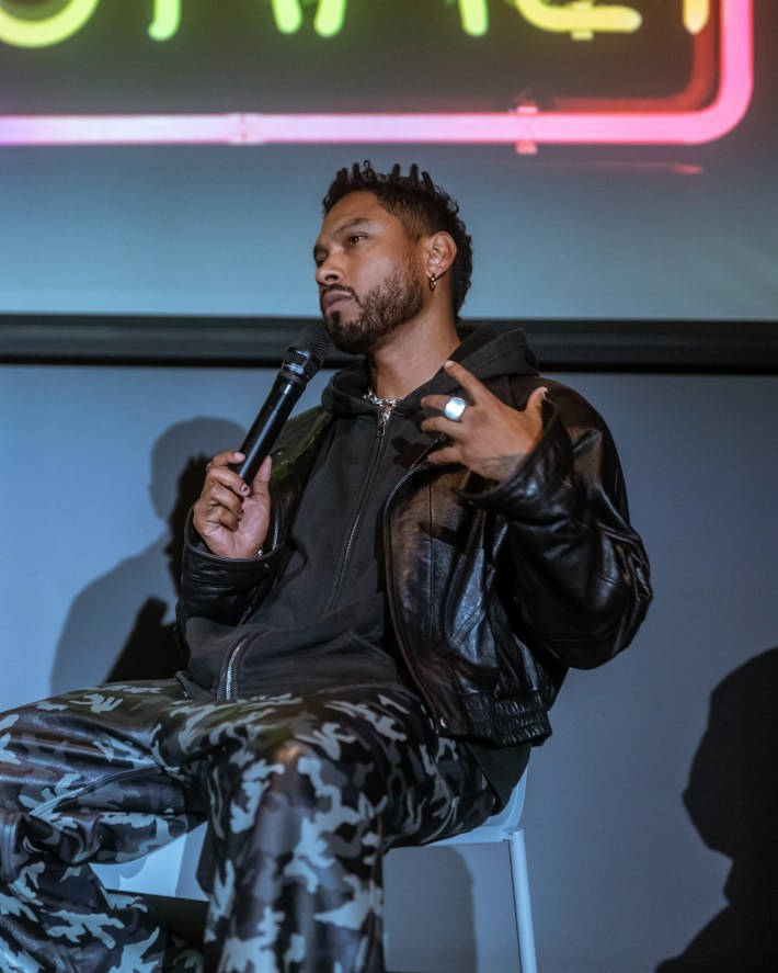 a man holds a microphone