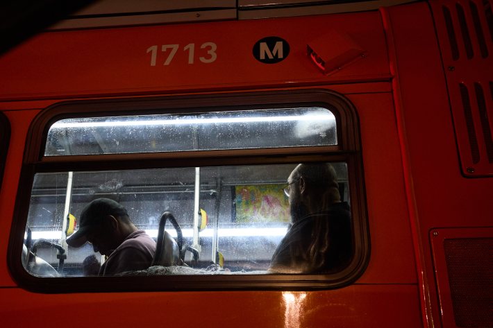 a bus window with people inside