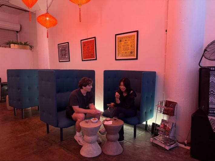 two customers chat while sitting