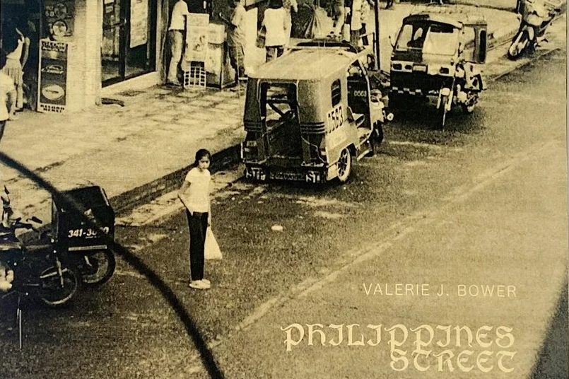 a zine cover depicting a street in the Philippines