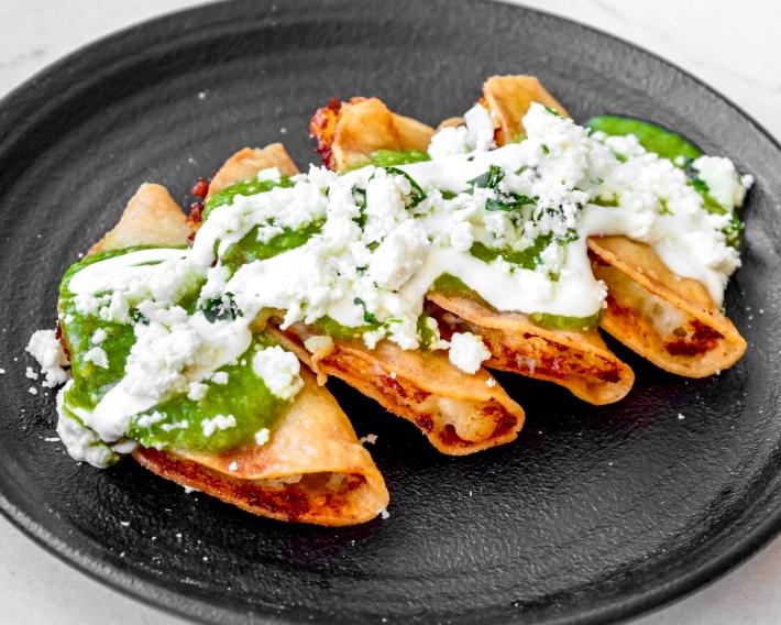 tacos smothered in cream and salsa