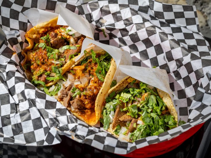 three tacos in a food basket