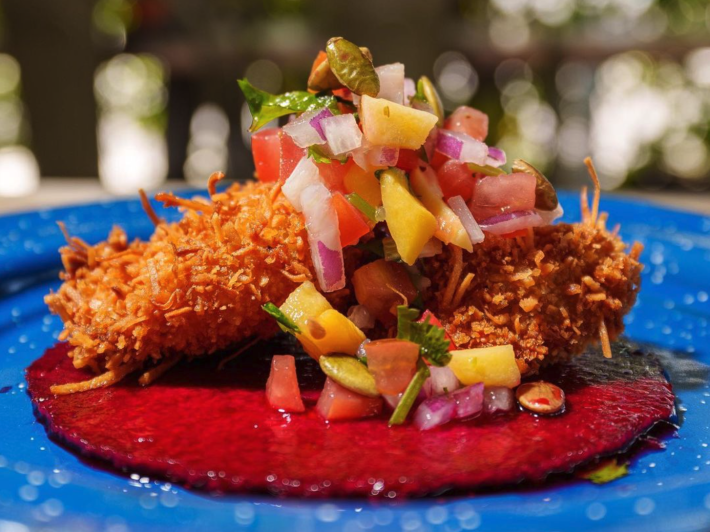 a coconut shrimp taco on a jicama tortilla