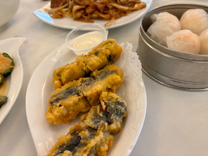 dim sum dishes on a white tablecloth