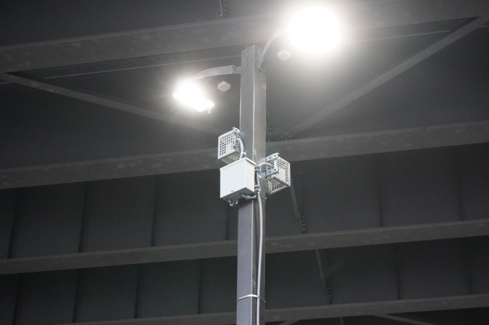 a sound-emitting machine posted onto a streetlight