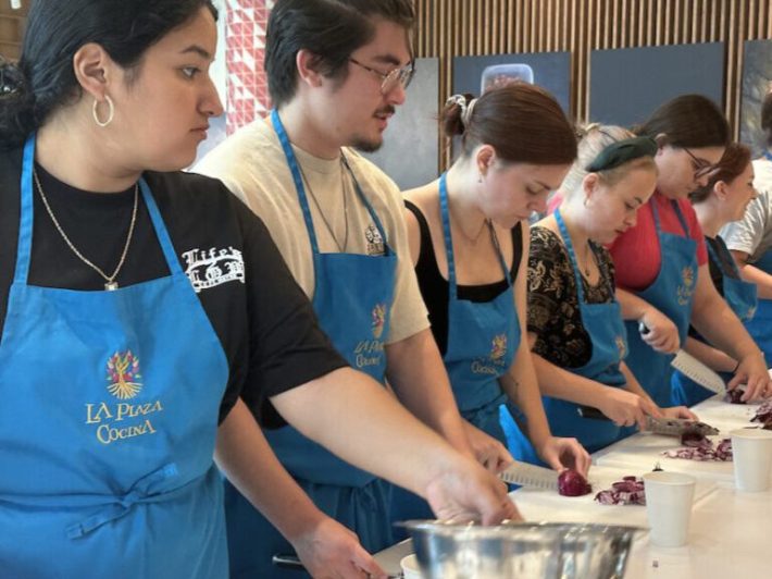 photo of cooking student standing at a counter