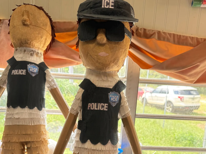 a pinata in the shape of an ICE agent
