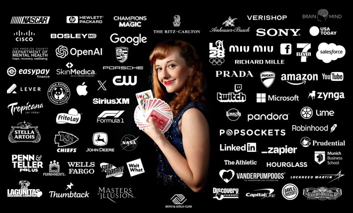 a woman with red hair spreads a deck of cards with corporate logos pasted around her