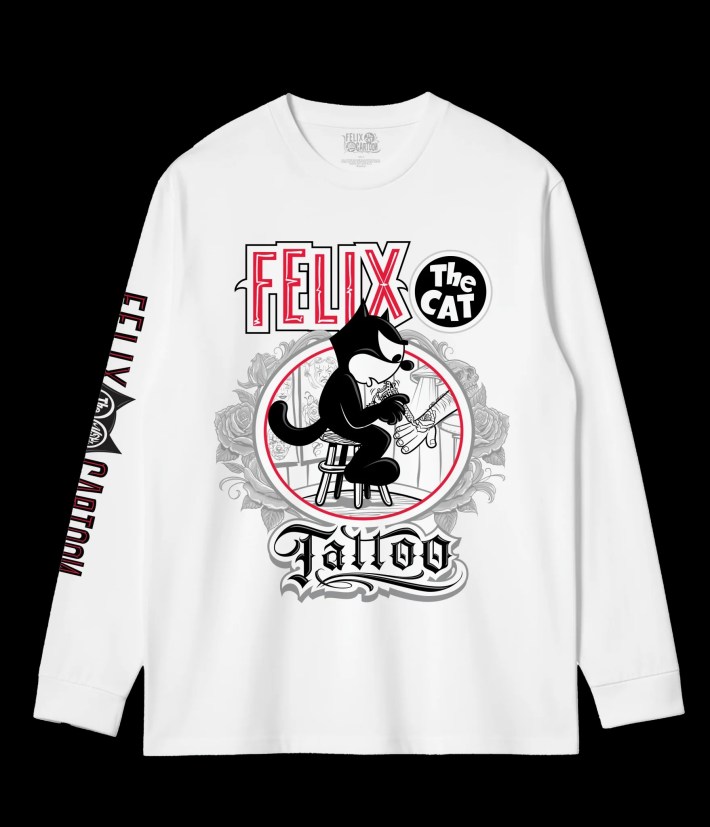 a white long sleeve t-shirt featuring a cartoon cat giving a tattoo