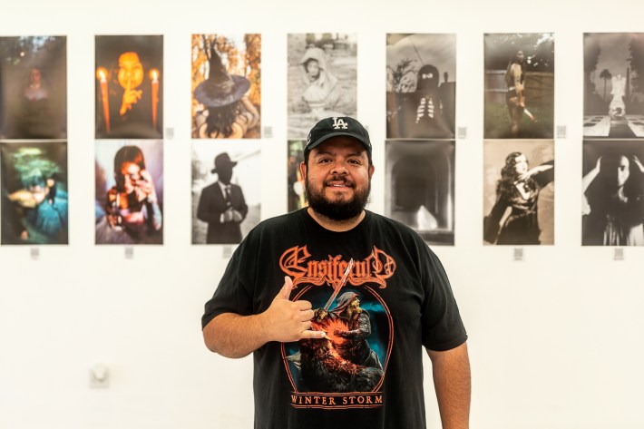 Owner operator Frank Ledezma standing in the gallery at East L.A. Film Shop