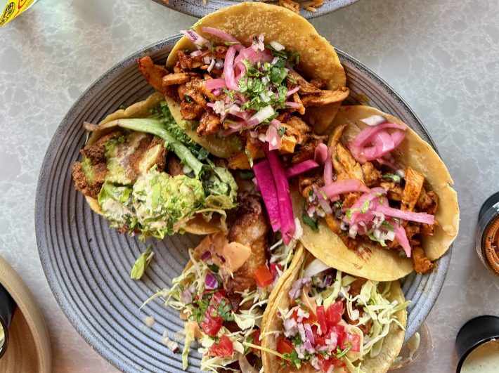 Salmon kabob plate and falafel, fish, and chicken shawarma tacos at Almaya. Photo by Javier Cabral for L.A. TACO.