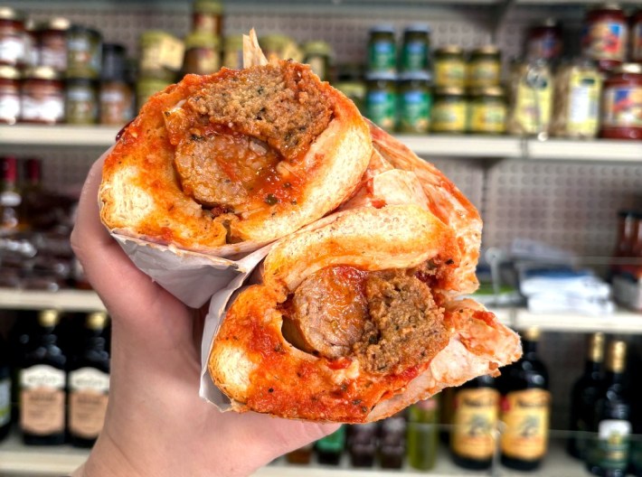 a cross-section of a sausage/meatball sub