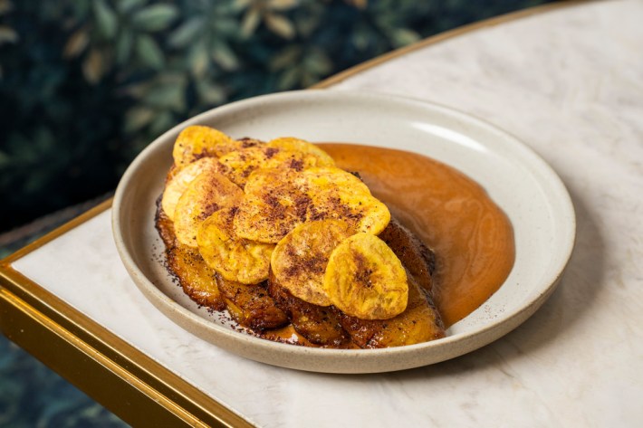 Plantain Expressions with maduros in plantain sauce with plantain chips