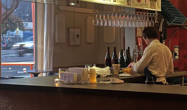 a bartender behind a bar