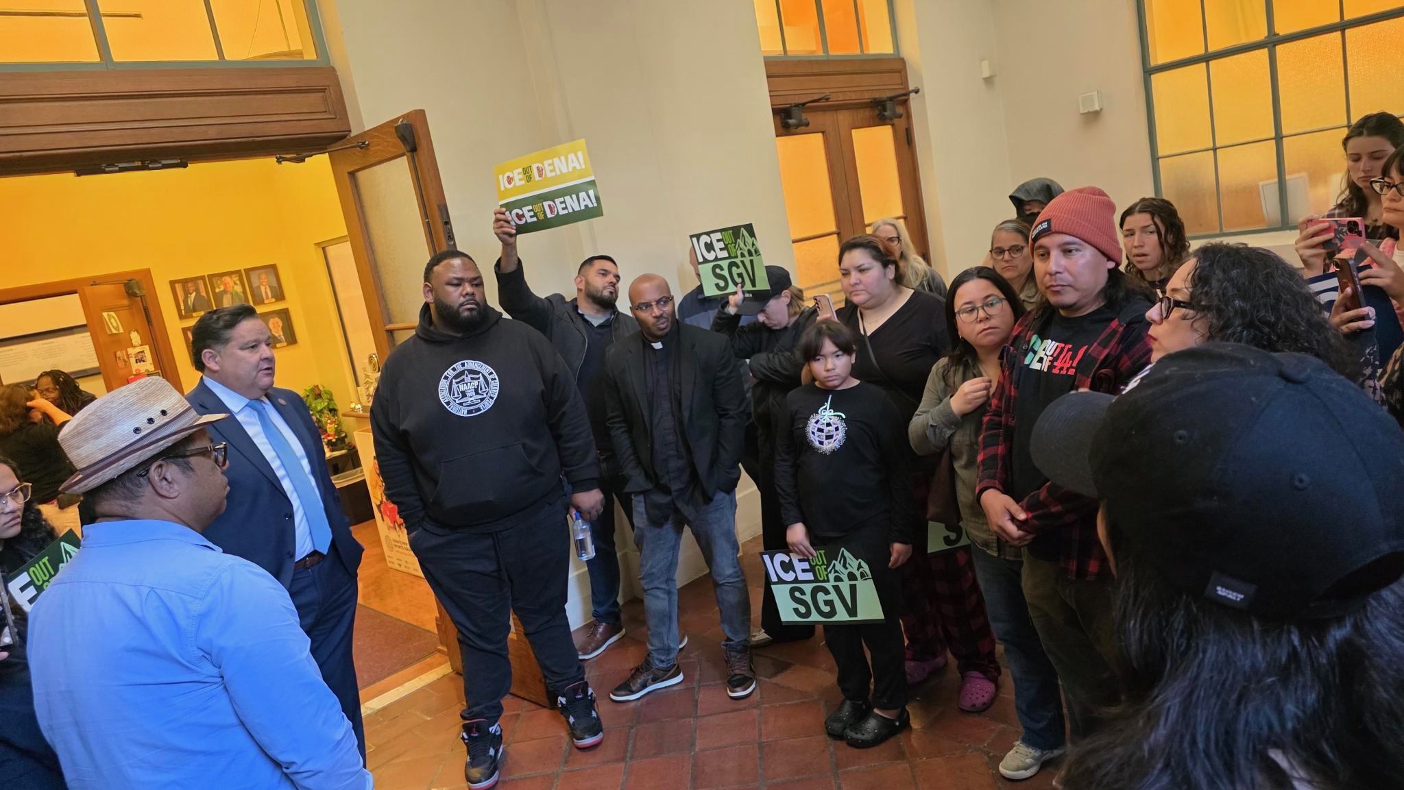 protestors outside of a mayor's office