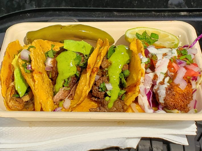 four tacos in a tray