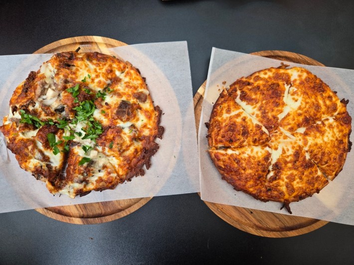Persian pizza with beef tongue (left) and cheese with a ketchup base (right).