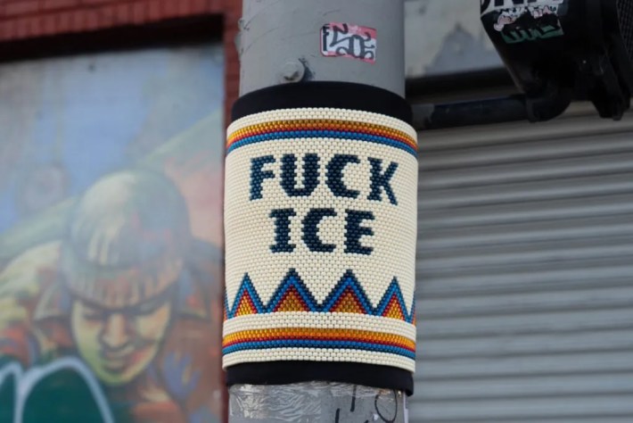 "FUCK ICE" bead bomb on a street pole