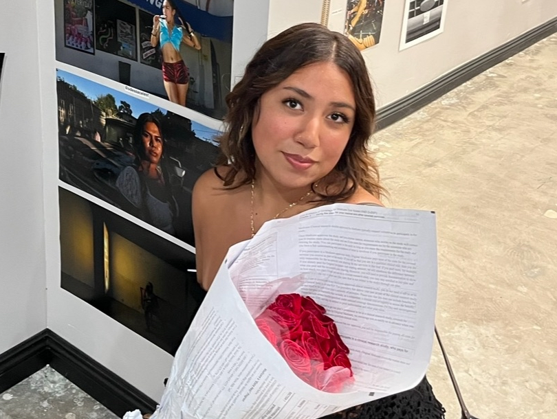 a young woman holds a bouquet of flowers
