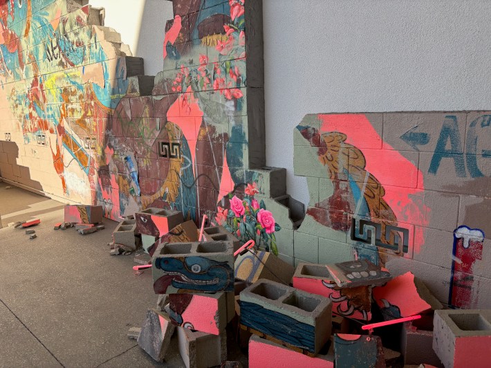 cinderblocks with artwork and neon lights