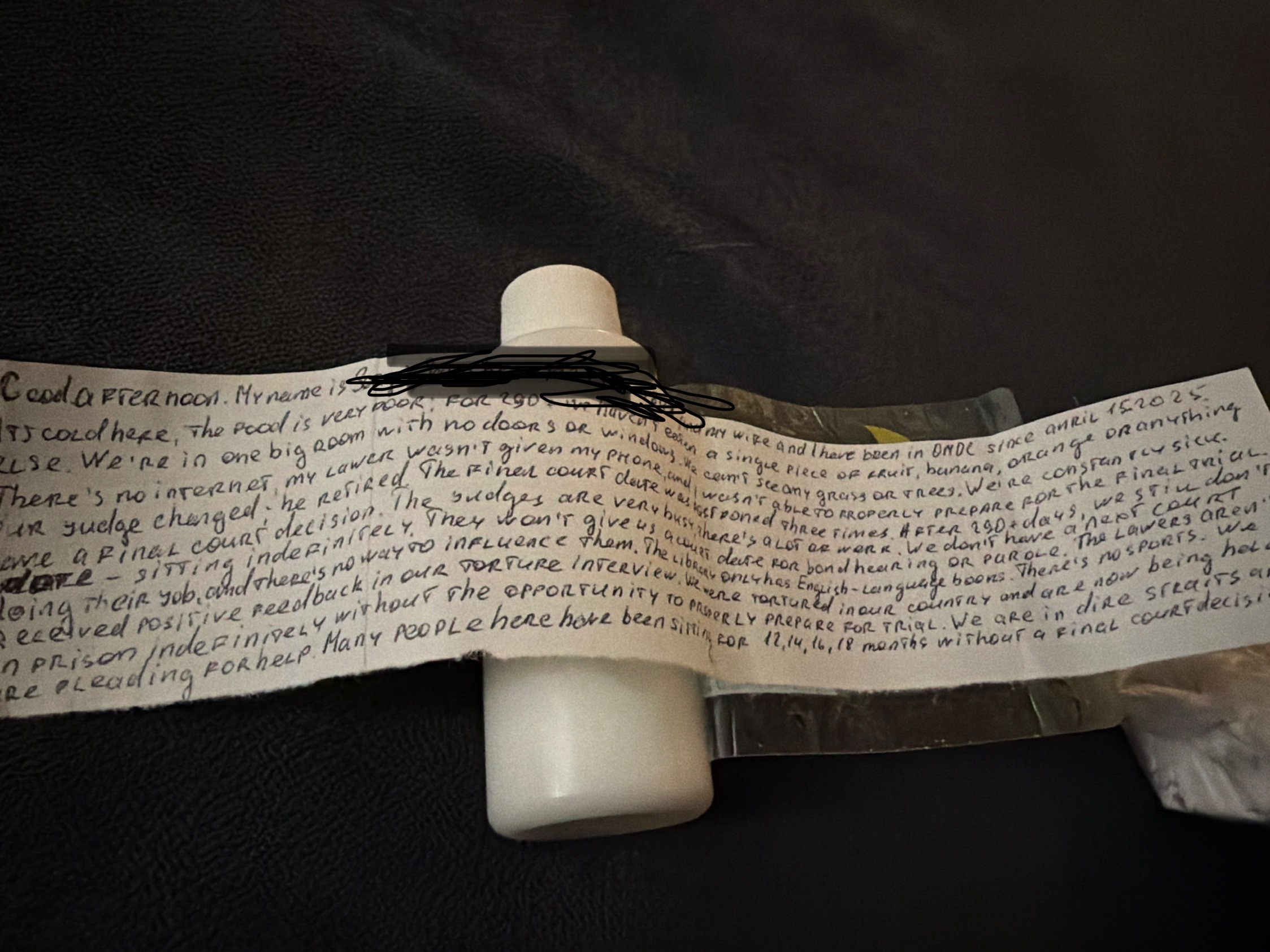 a lotion bottle with a note