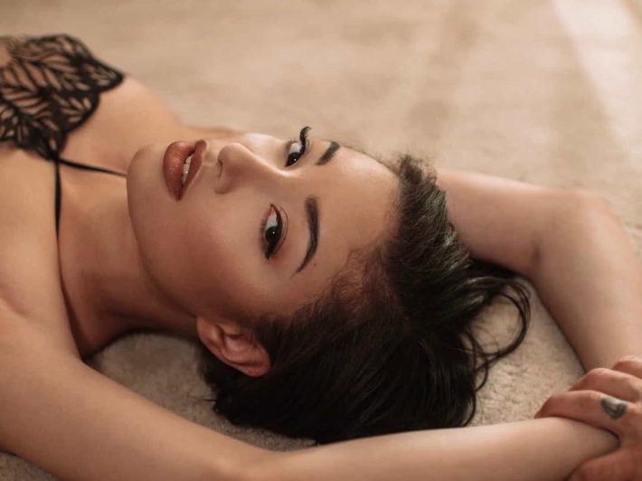 a woman lies on the ground