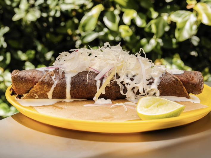 Deep fried fish flauta from Ditroit with cheese, sour cream and avocado salsa.