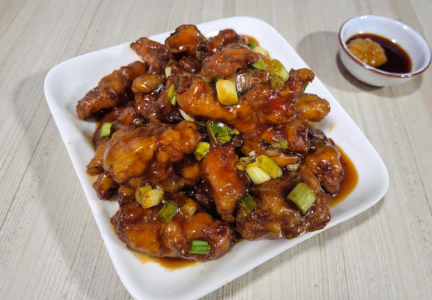 Orange chicken on a white plate