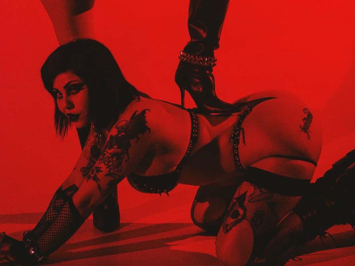 a woman is on all fours on the ground