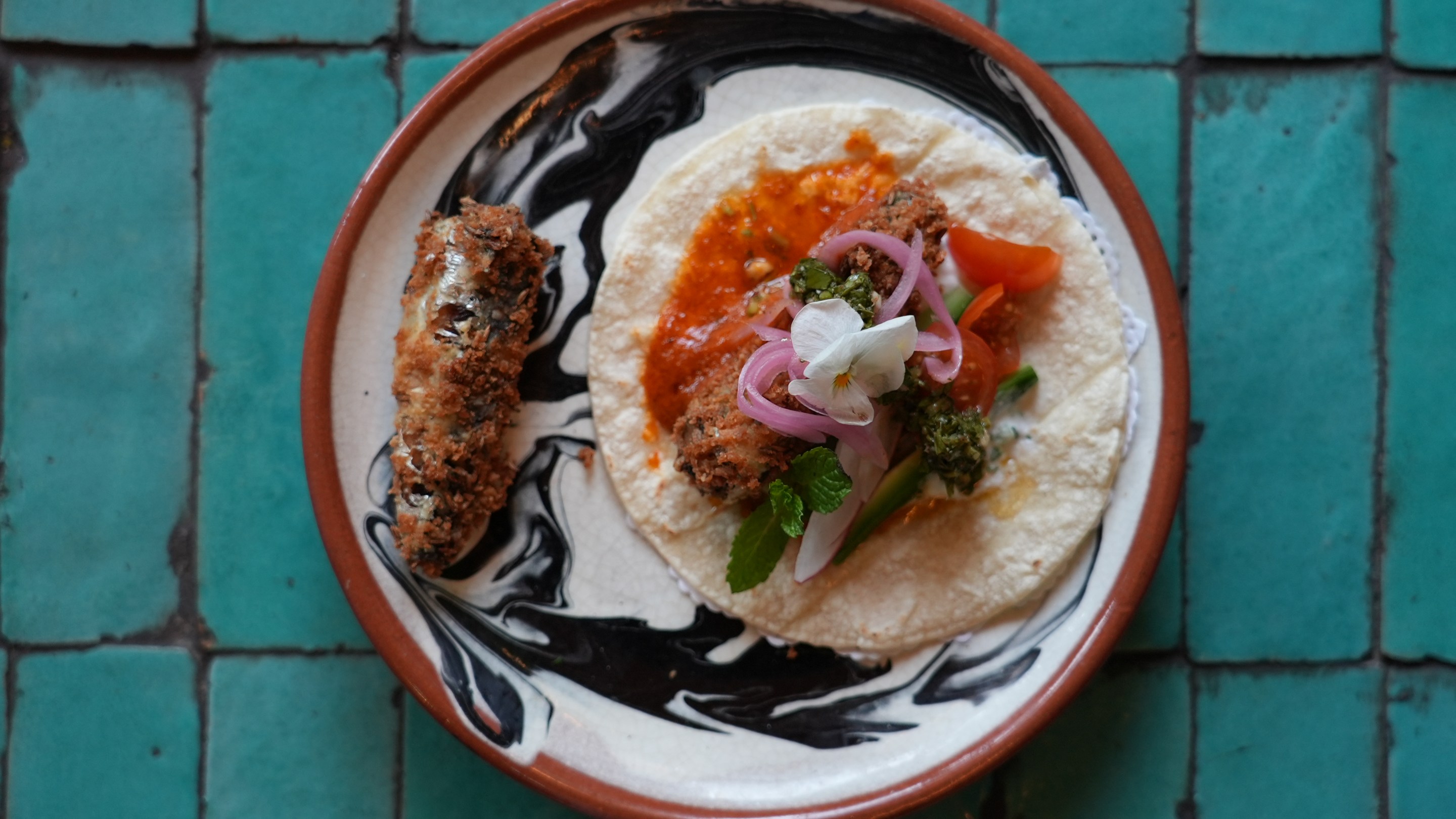 a plate of sardine tacos