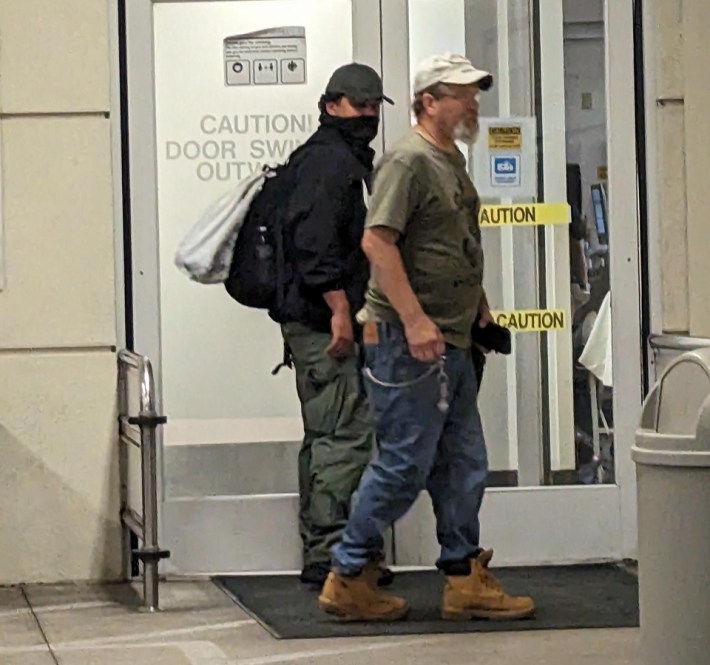 two officers leaving a hospital in plainclothes