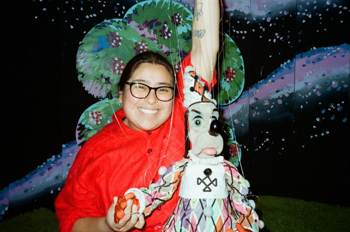 a woman and a frowning dog puppet