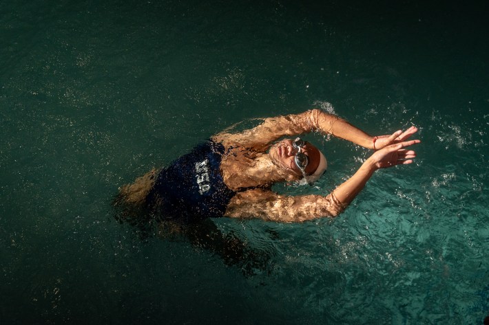 a swimmer in the pool on her back