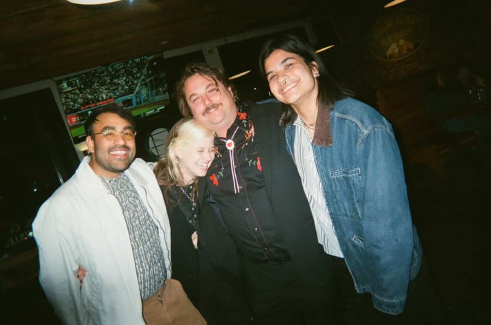 a band posing together