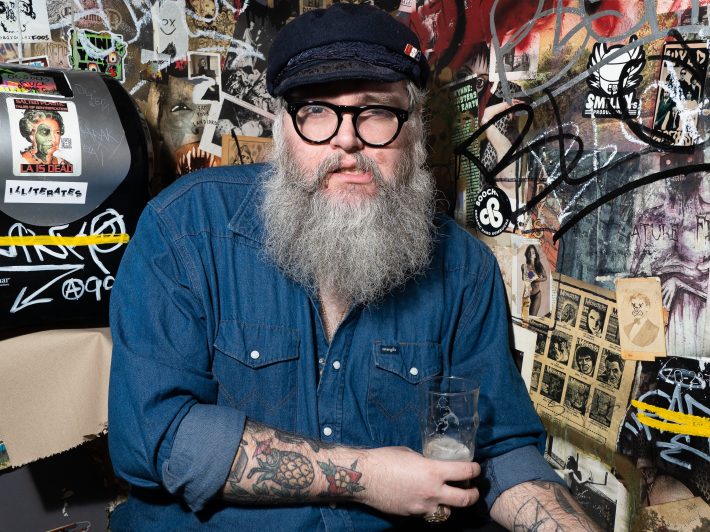 a man with a beard and hat