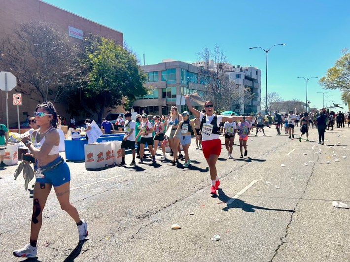 marathon participants, including one cheering