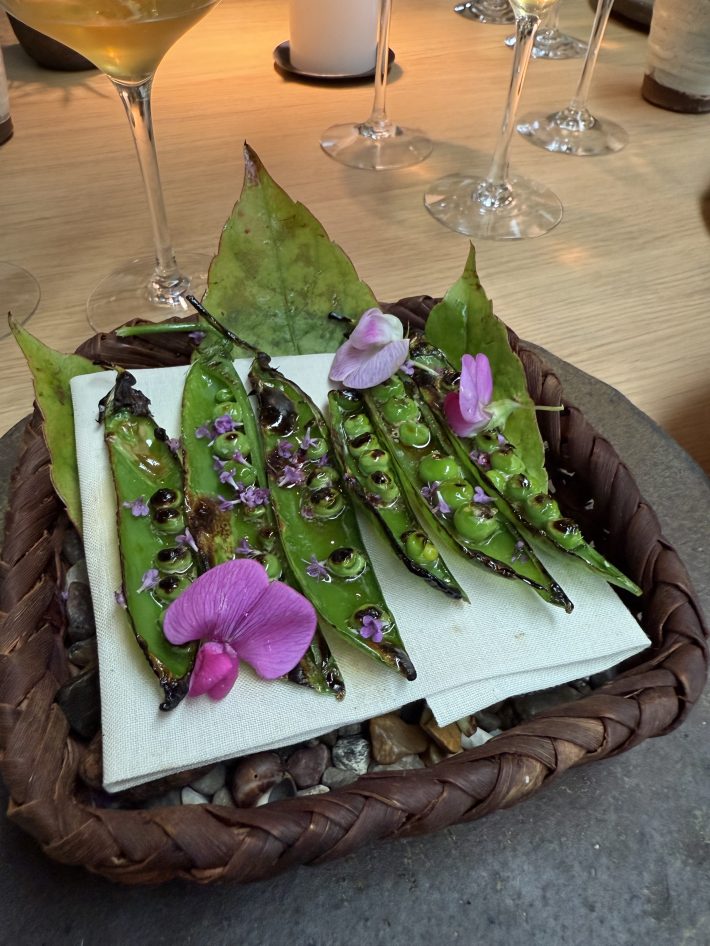 Barbecued peas in a pod at Noma in 2025.