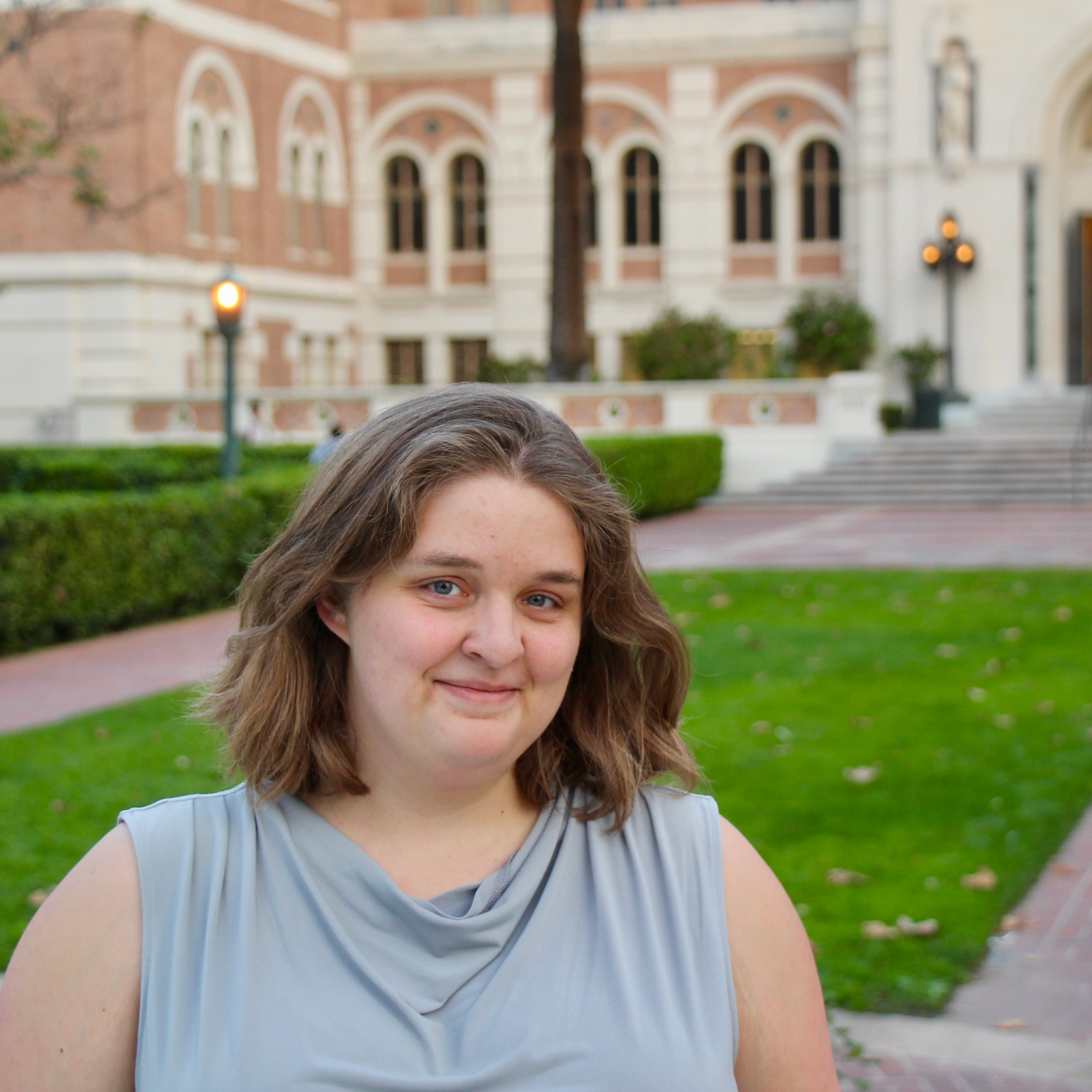 a person stands on a college campus