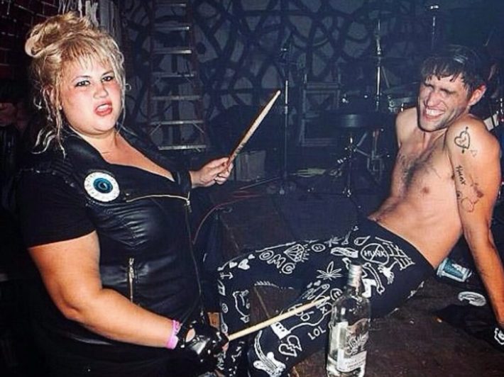 a woman and man at a stage