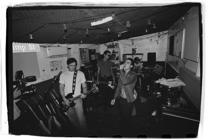 four men playing in a band